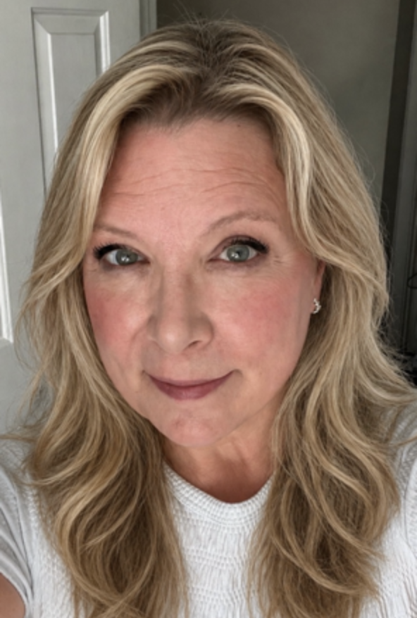 Laurie Keegan, district 1:1 nurse smiles at the camera